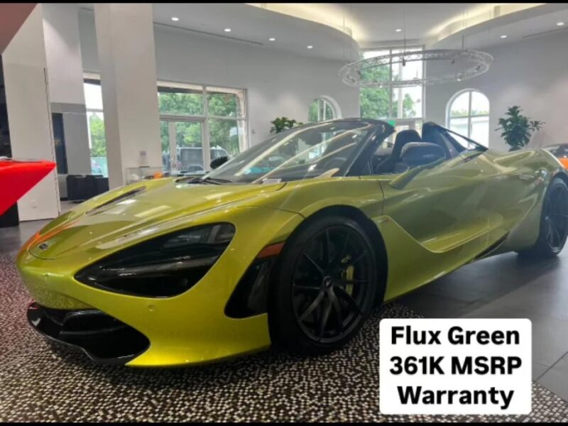 A lime green sports car, reminiscent of St. Patrick's Day cheer, is showcased in a well-lit showroom. A sign reads, "Flux Green 361K MSRP Warranty.