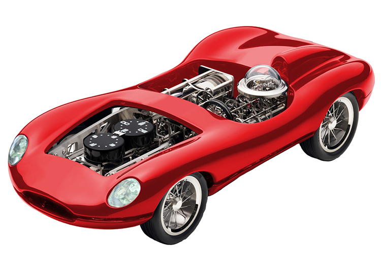 A red, futuristic Ferrari concept car model with an exposed engine and mechanical components captivates enthusiasts. Its streamlined design features a shiny finish and rounded edges, leaving no visible wheels or interior details for the truly passionate to dream about.