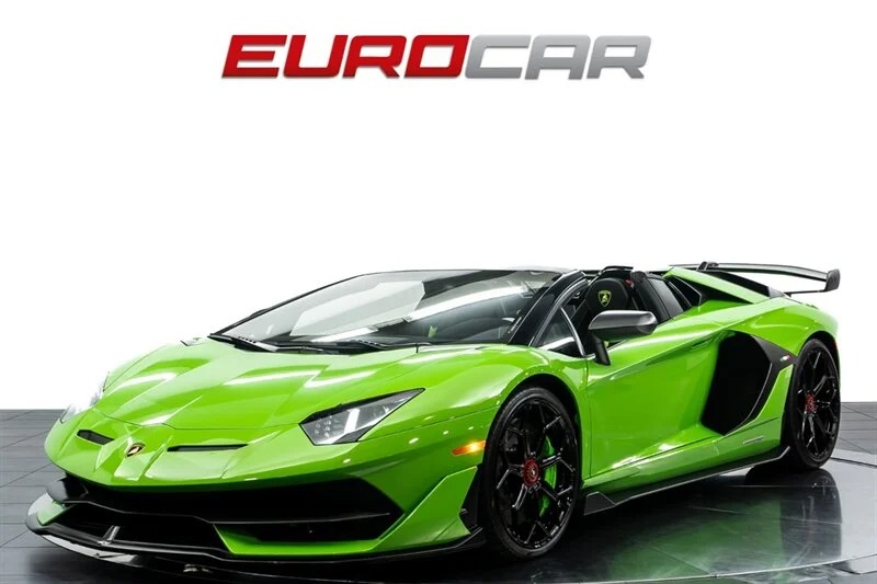 A stunning green Lamborghini Aventador SVJ sits proudly on the showroom floor, with the "EUROCAR" logo gleaming above it.