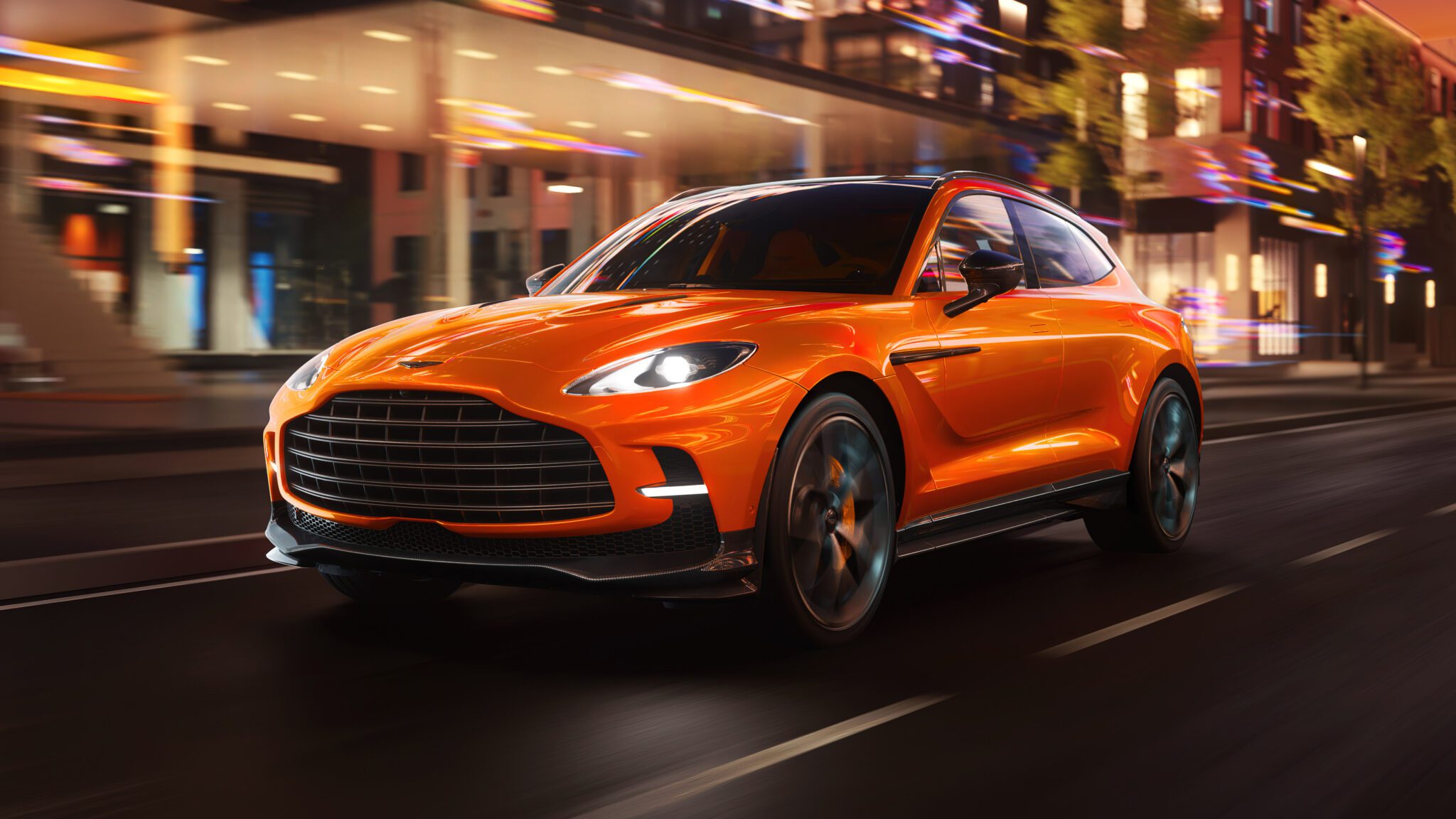 An image of an Aston Martin DBX on the street.