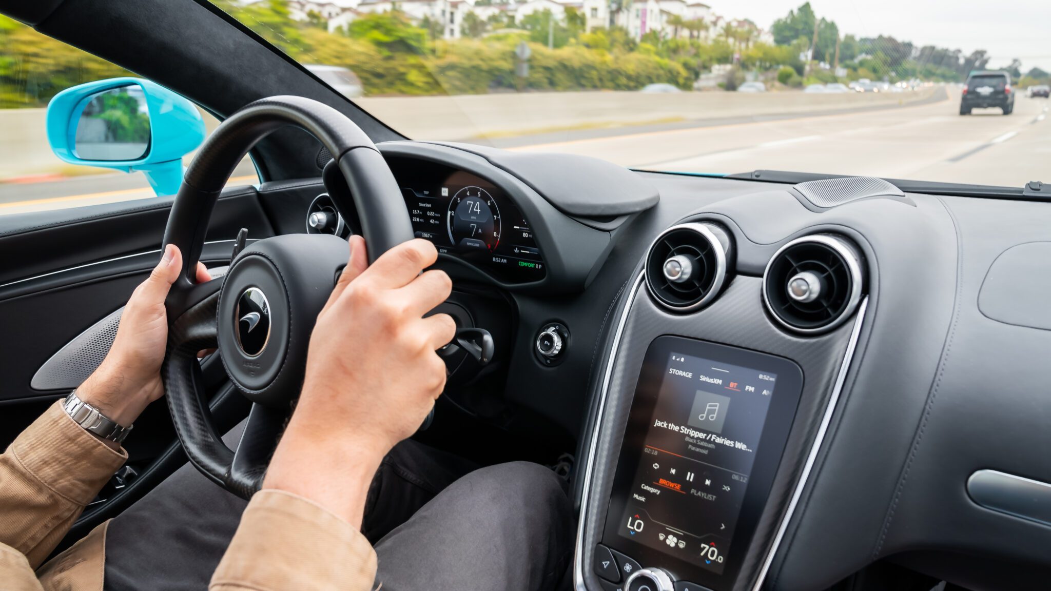 An image of a car's interior while driving.