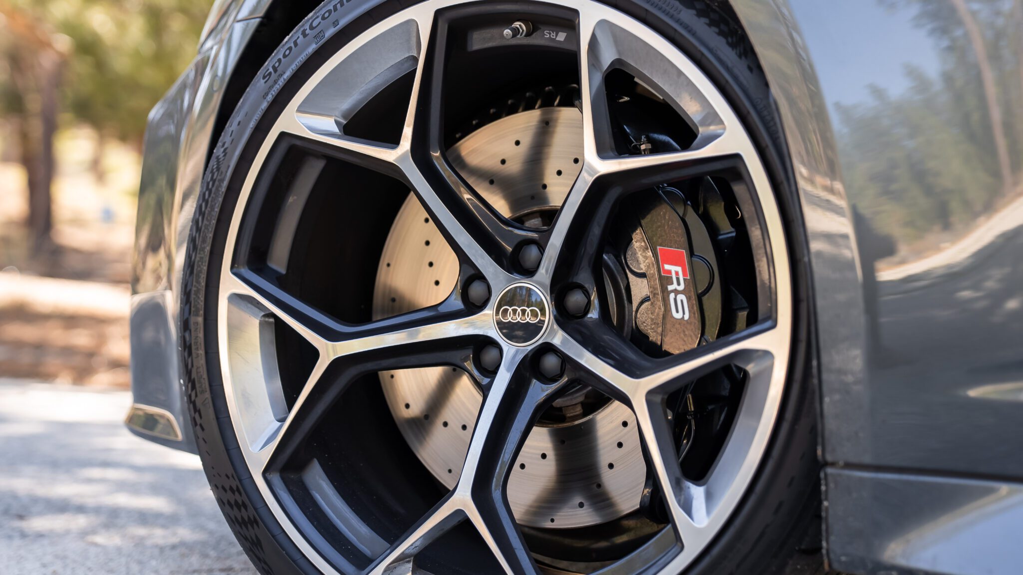 A close up image of a car's wheel.