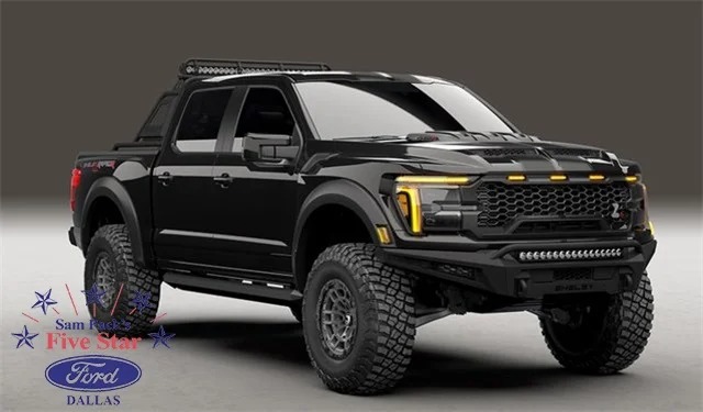 A black Ford F-150 pickup truck with rugged tires and off-road accessories proudly displays the "Sam Pack's Five Star Ford Dallas" logo in the bottom left corner. Perfect for every adventure, this formidable vehicle could be yours—buy today and hit the road in style.