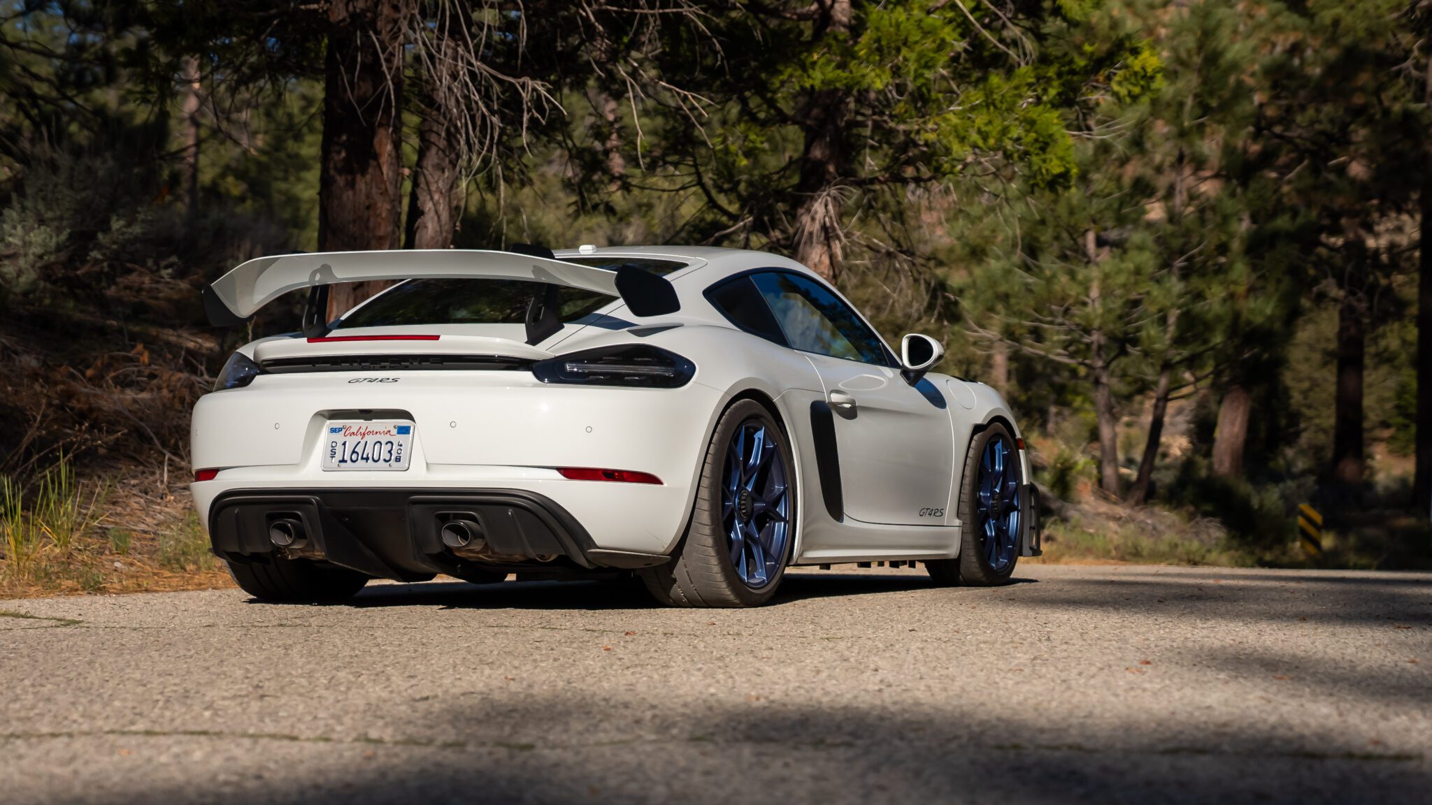 An image of a Porsche 718 Cayman GT4 RS parked outdoors.