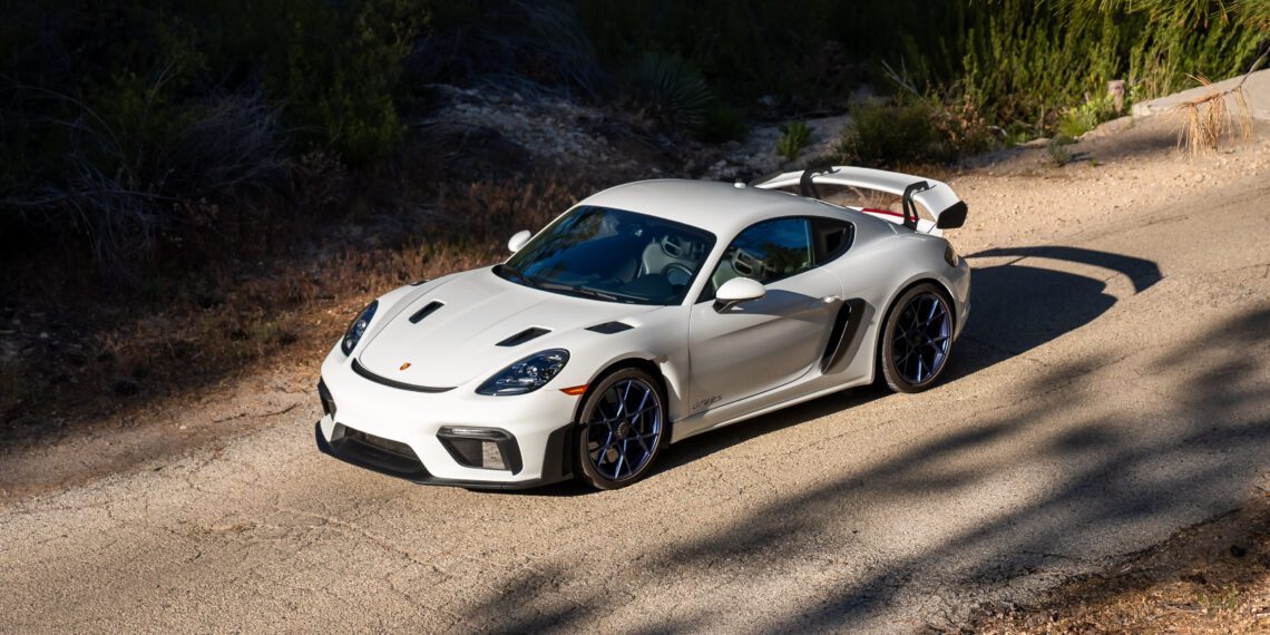 An image of a Porsche 718 Cayman GT4 RS parked outdoors.