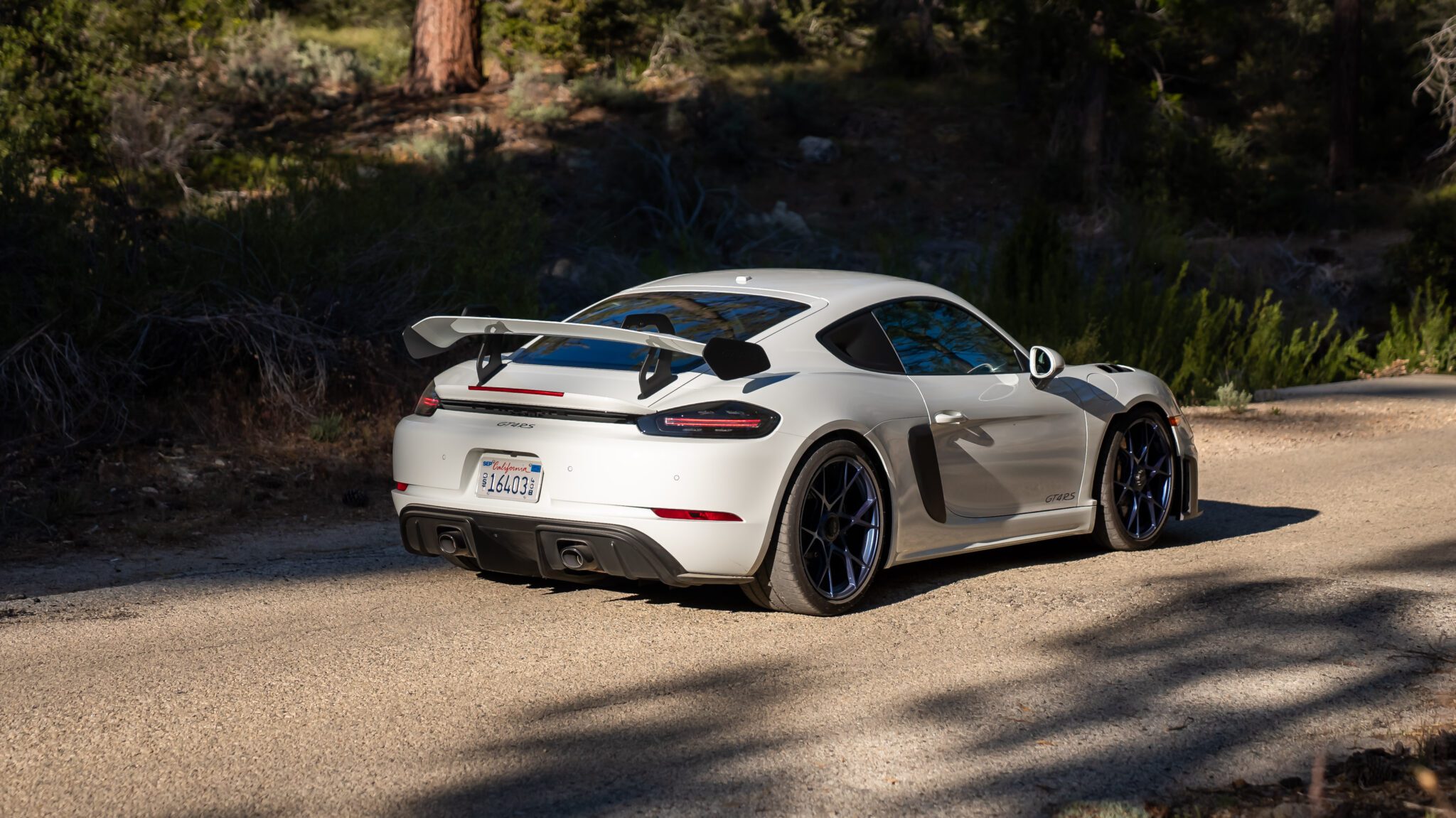 An image of a Porsche 718 Cayman GT4 RS parked outdoors.