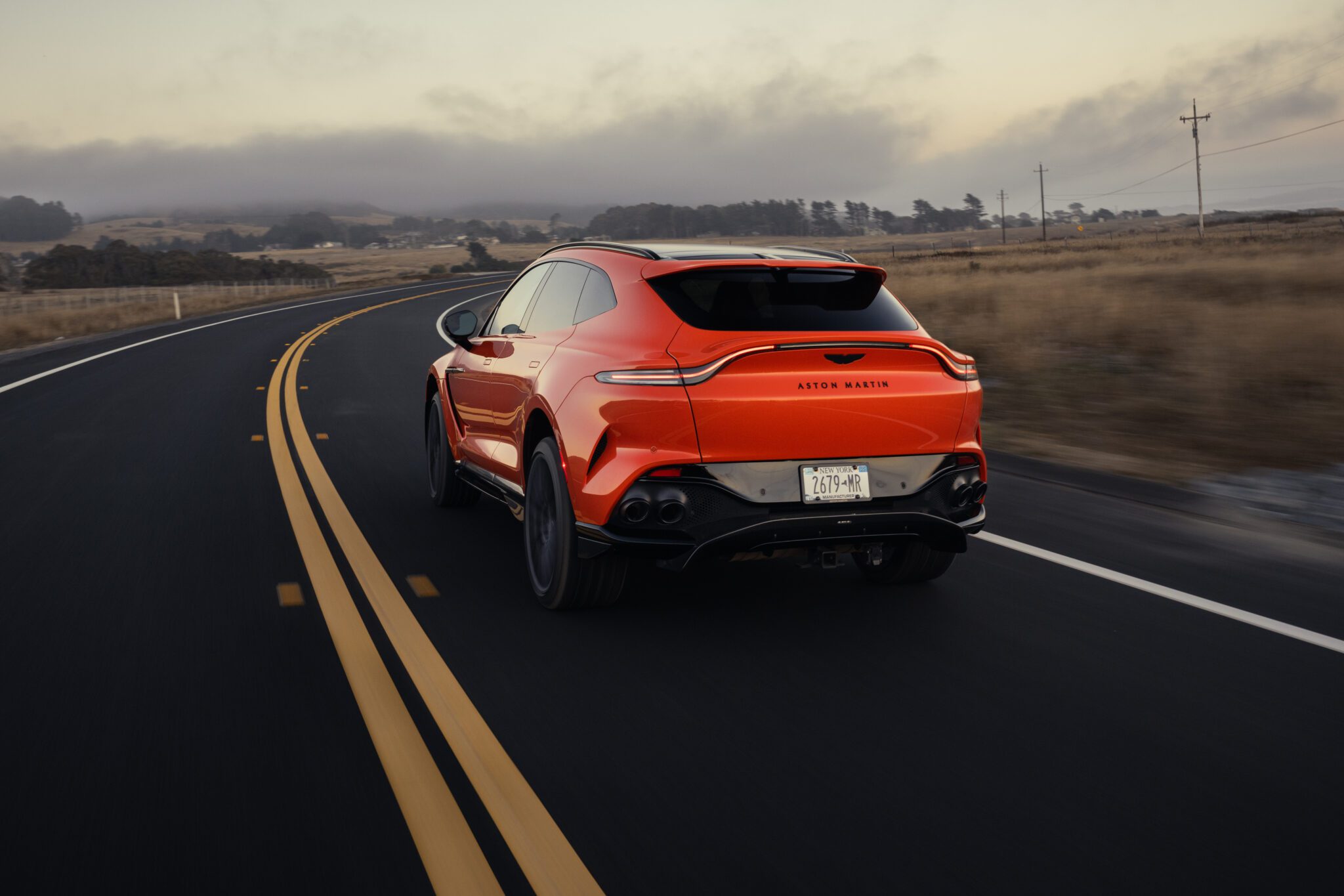 An image of an Aston Martin DBX707 out on the road.