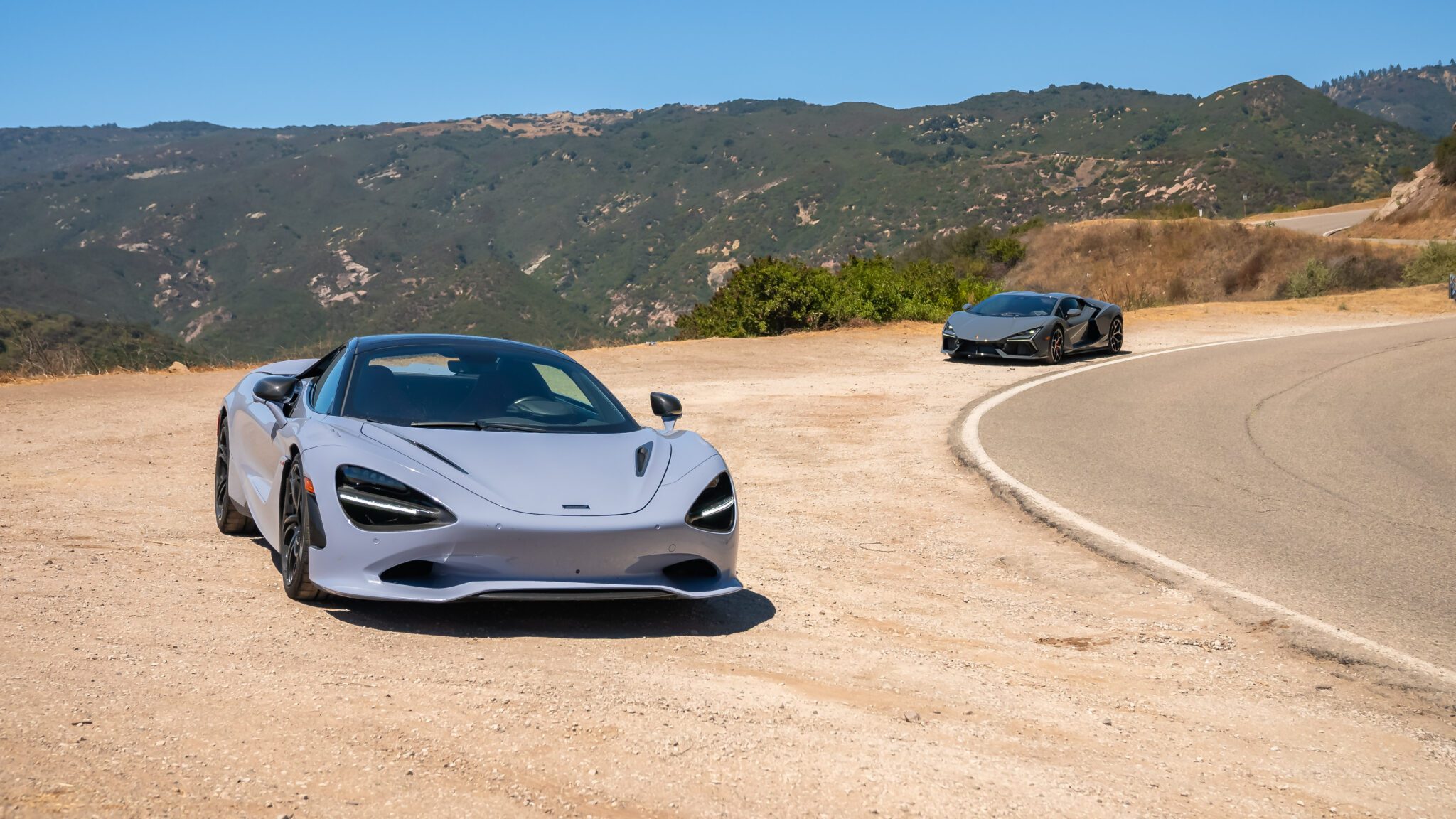 An image of two cars parked outside.