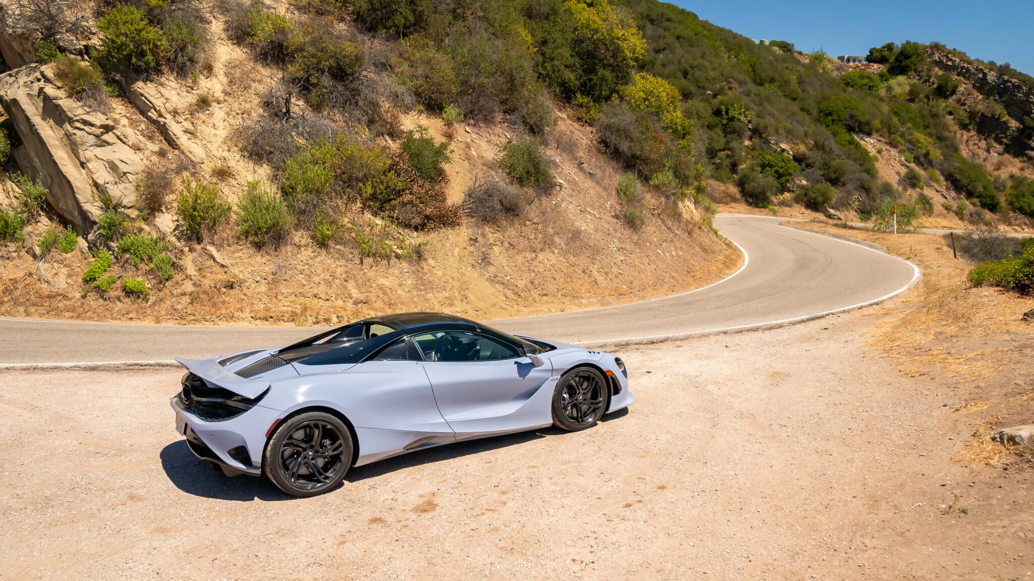 An image of a McLaren 750S Spider parked outdoors.