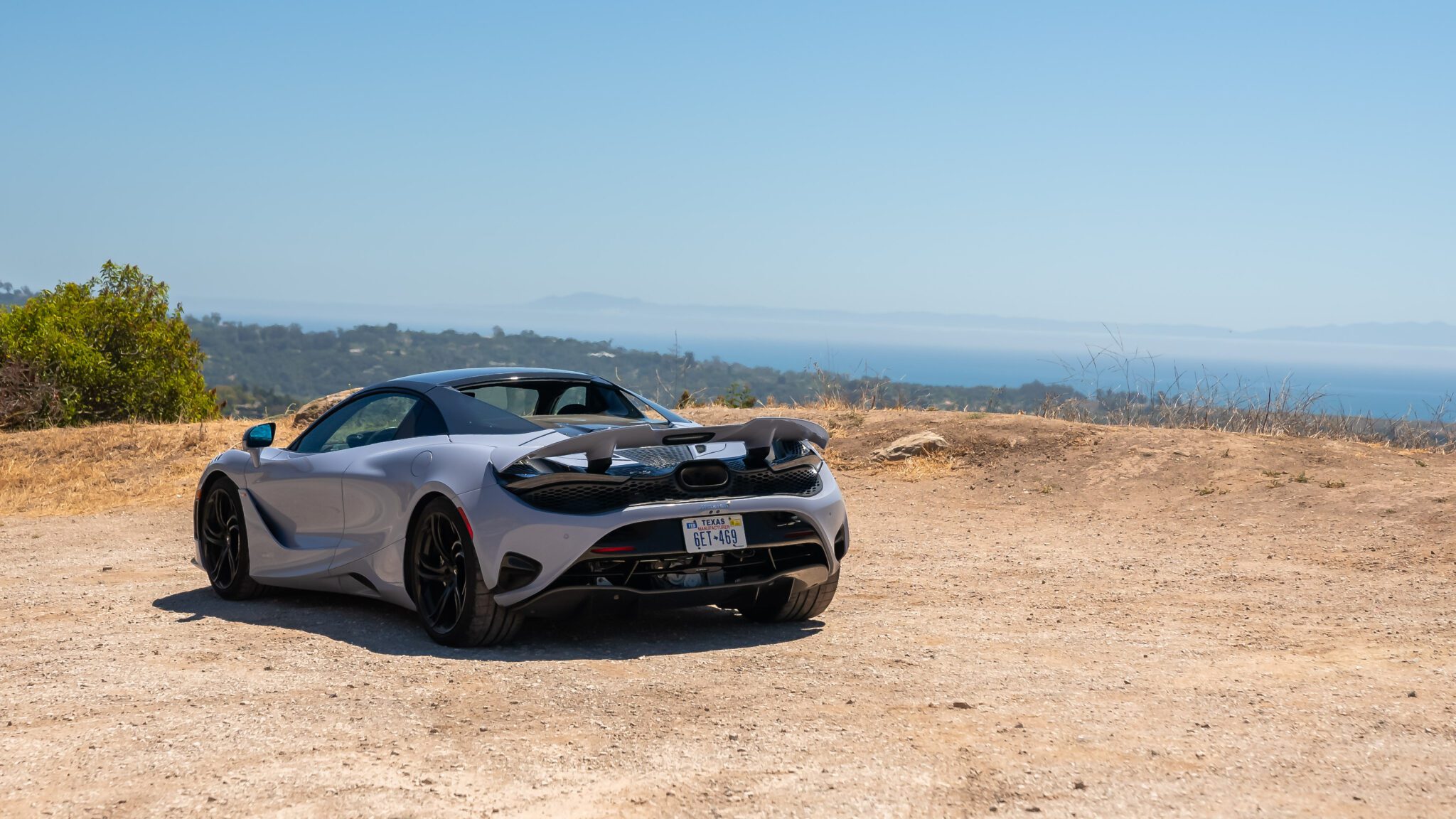 An image of a car overlooking the Pacific Ocean.