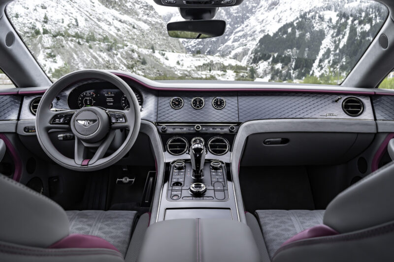 An image of a Bentley Continental GT Speed on a mountain road.