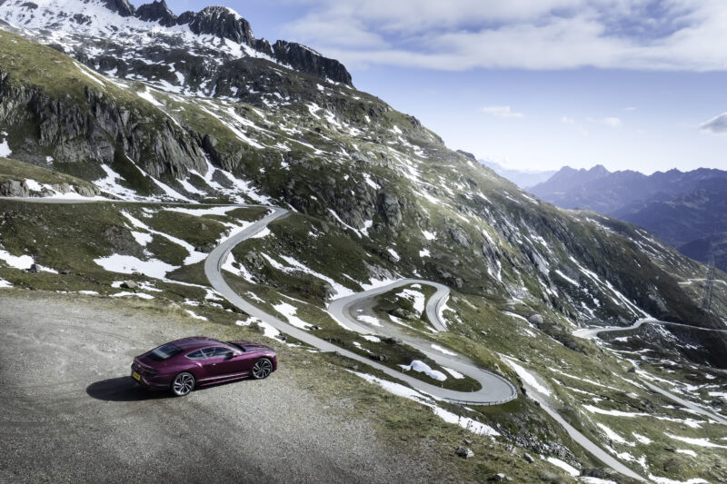 An image of a Bentley Continental GT Speed on a mountain road.