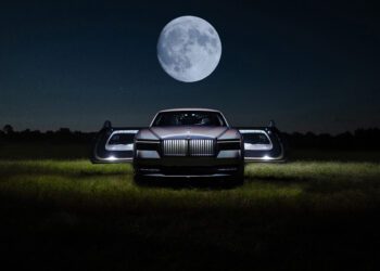 An image of a Rolls-Royce Spectre Lunaflair parked outdoors.