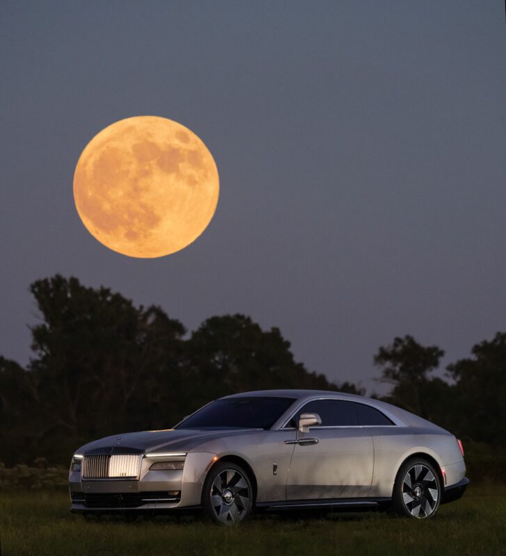 An image of a Rolls-Royce Spectre Lunaflair parked outdoors.