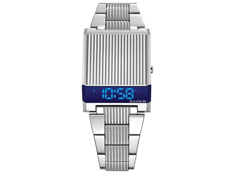 This digital wristwatch, part of our under $500 collection, features a silver metal band and a textured rectangular face displaying the time "10:58" in striking blue numbers.