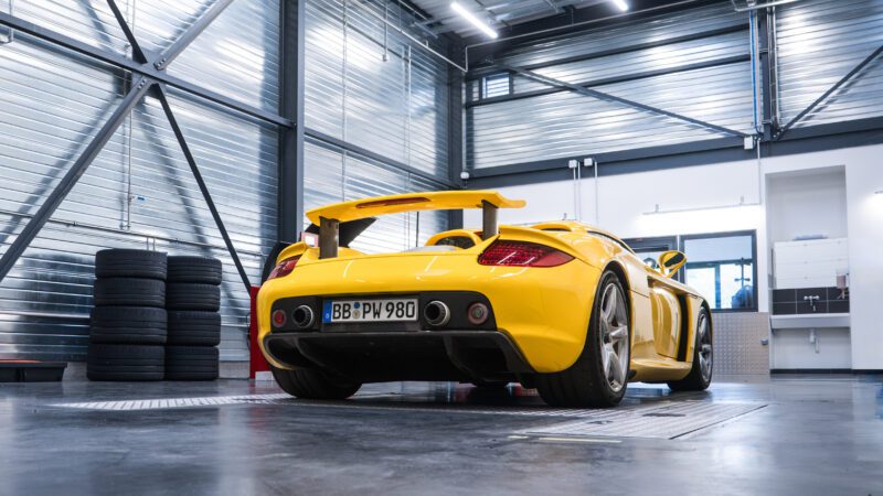 An image of a Porsche Carrera GT on a track.