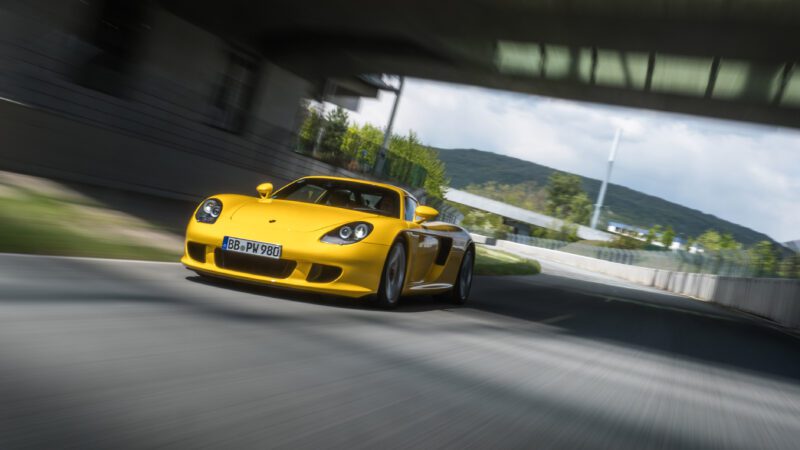 An image of a Porsche Carrera GT on a track.