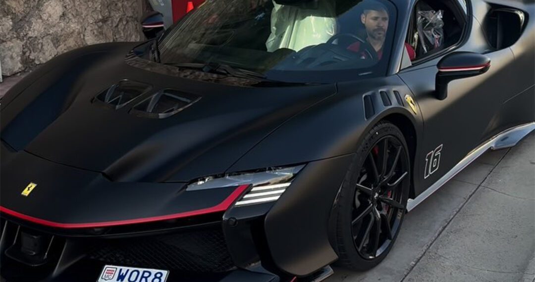 A man sits in a parked, black sports car with red accents, mirroring the sleek design of a Ferrari SF90 XX. The Monaco air complements his customized license plate, exuding an aura reminiscent of Charles Leclerc's racing finesse.