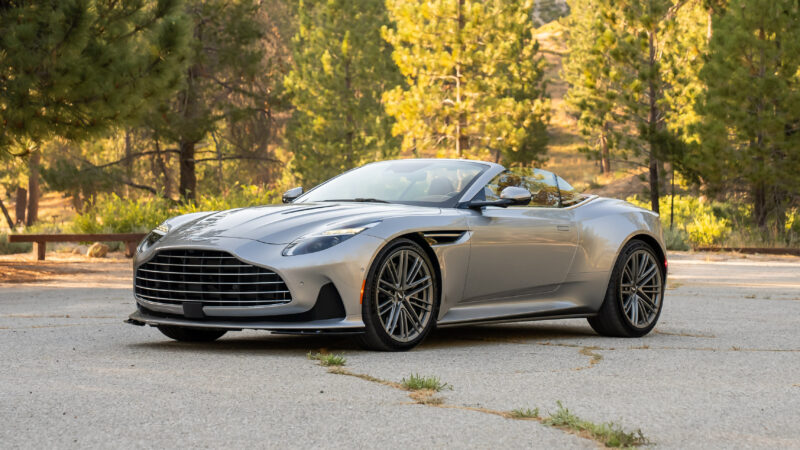 An image of an Aston Martin DB12 Volante parked outdoors.