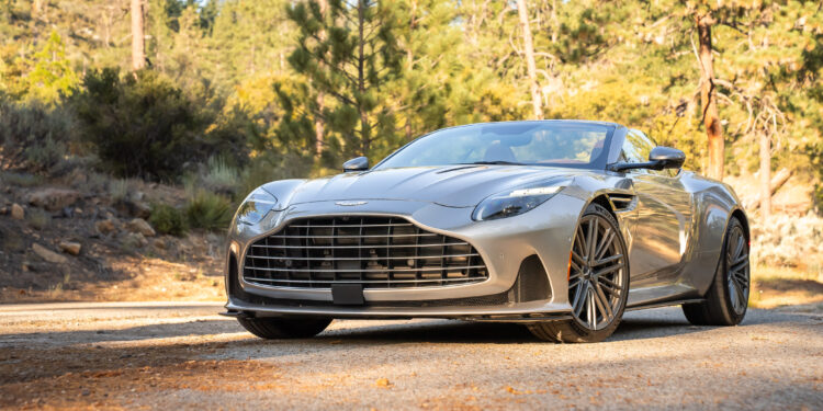 An image of an Aston Martin DB12 Volante parked outdoors.