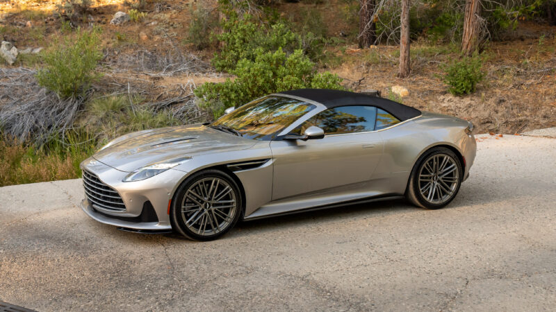 An image of an Aston Martin DB12 Volante parked outdoors.