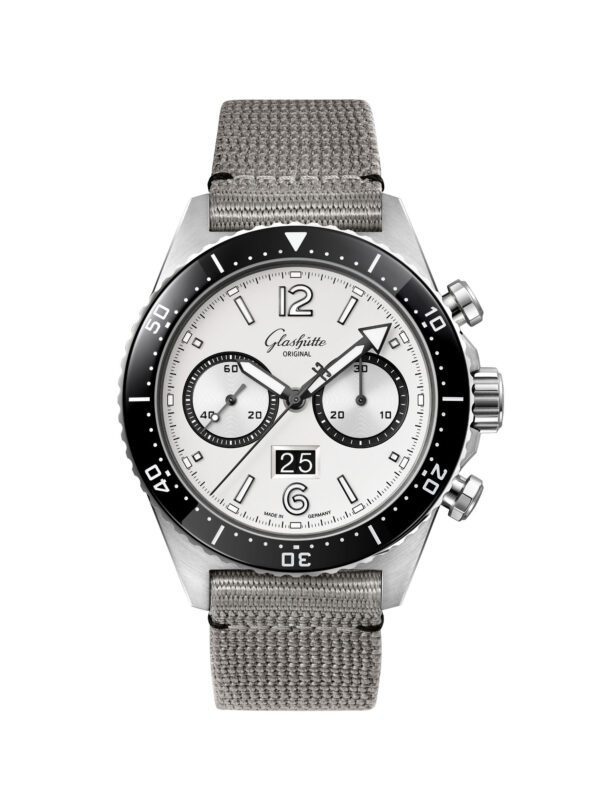 This SeaQ Chronograph by Glashütte Original features a stainless steel case, white dial, black bezel, and a gray fabric strap. The watch includes a date display at the 6 o'clock position, offering precise craftsmanship that ensures you’re always ready for life's "Lights Camera Action" moments.