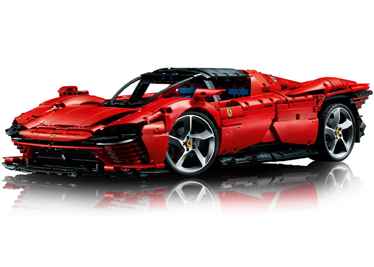 This Automotive-Inspired LEGO set features a red supercar model with a sleek design, detailed features, and five-spoke wheels that capture the essence of a sports car. Perfectly displayed on a reflective surface, it's among the best LEGO sets for car enthusiasts.