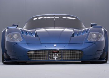 Front view of a blue Maserati sports car with "MC12" displayed on the windshield, embodying the elegance typically celebrated at Auto e Moto d'Epoca.