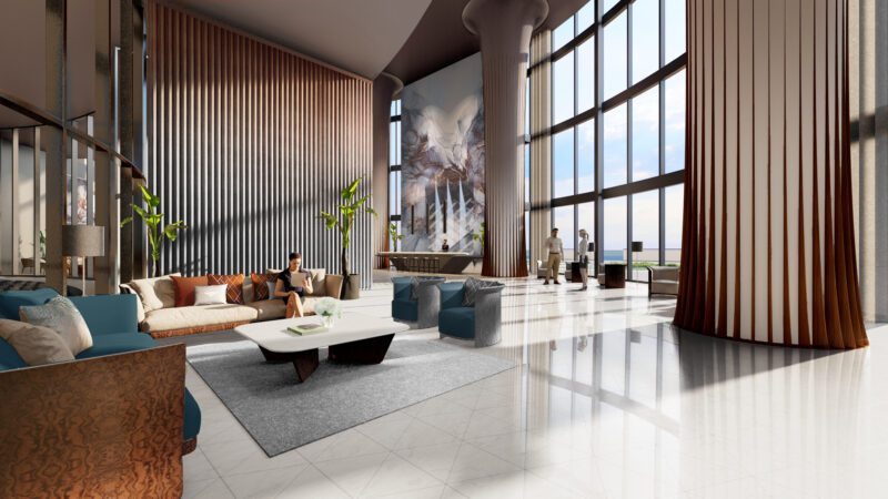 The spacious modern lobby at Bentley Residences features large windows, stylish furniture, and captivating wall art. This luxurious setting includes an elegant seating area with sofas and a coffee table, all hinting at the future of refined living, while people gather near the entrance.