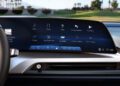 Close-up of a Cadillac dashboard displaying a digital infotainment screen with options for audio, phone, maps, climate, and apps—elevating the experience of this luxury EV.