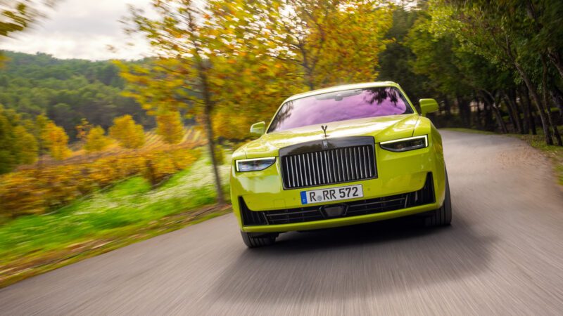 An image of a yellow Rolls-Royce Ghost Series II on the road.