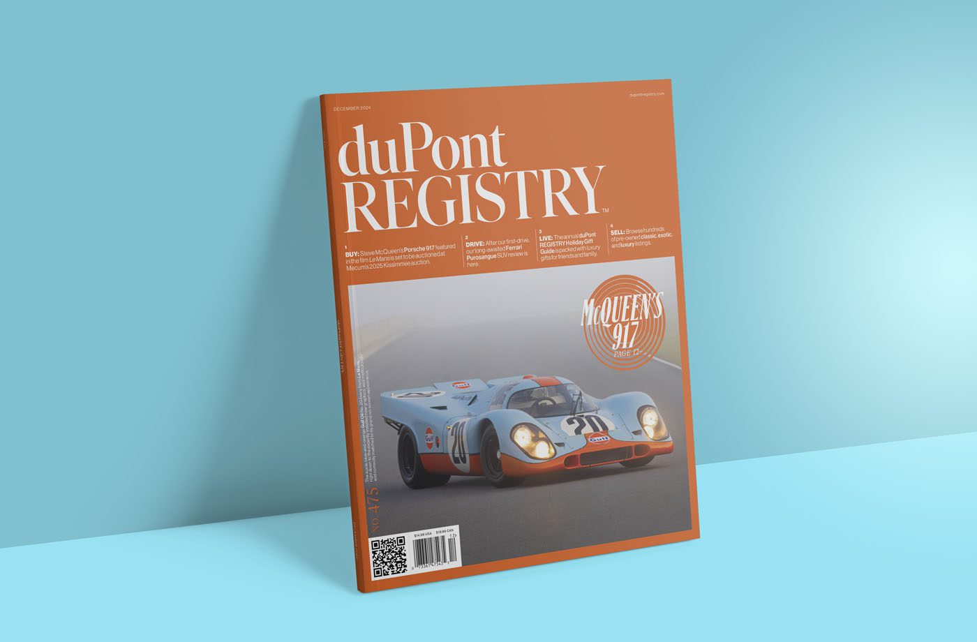 A magazine with an orange cover showcases a vintage race car labeled 23, under the banner "duPont Registry." A circular emblem reads "McQueen's 917." Dive into the duPont REGISTRY December 2024 edition for the ultimate Gift Guide.