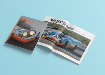 Two magazines are displayed on a light blue surface—one closed, showcasing a racing car, perfect for the discerning reader's December 2024 wish list. The other is open to reveal "McQueen's 917" roaring down the track, offering a taste of duPont REGISTRY's ultimate gift guide.