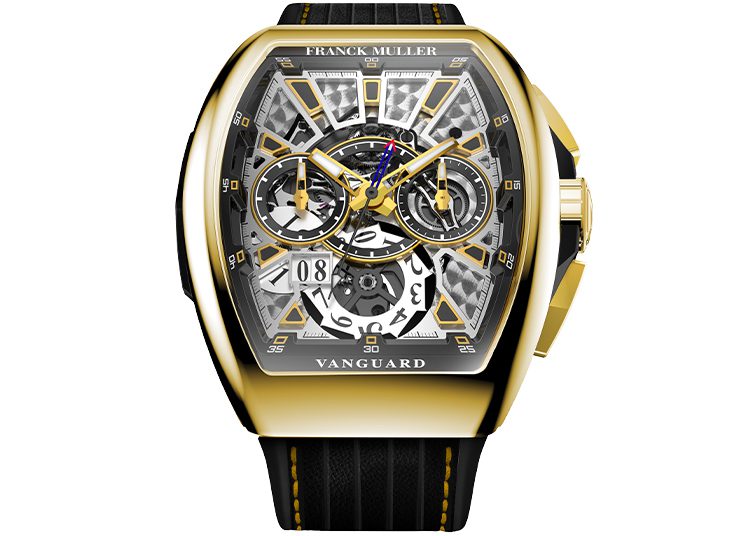 Discover the Luxurious Franck Muller Vanguard wristwatch, featured in the duPont REGISTRY. It boasts a gold-colored case, an intricate dial with multiple circular sub-dials, and a black leather strap with yellow stitching—an epitome of elegance in the Luxury Watch Guide.