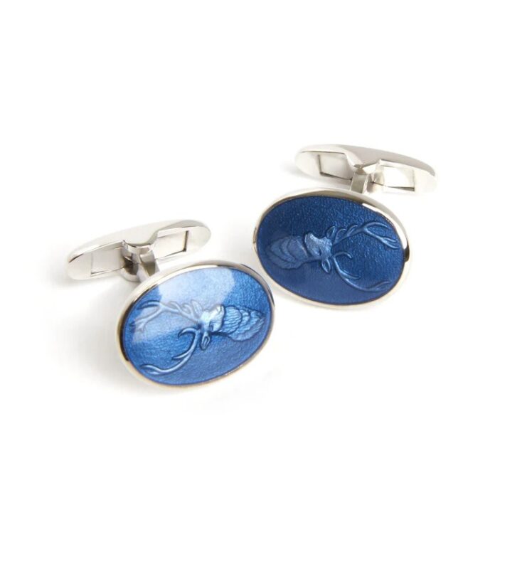 These luxury silver cufflinks showcase oval, blue enamel fronts with an embossed lobster design, making them the perfect statement accessories.