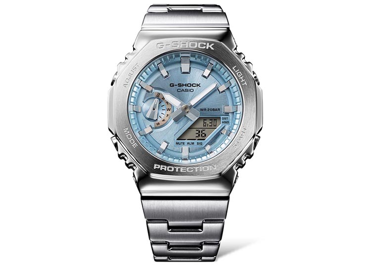 A stainless steel Casio G-Shock wristwatch with a blue dial, analog, and digital display showcasing the date and time—a true gem in any Luxury Watch collection.