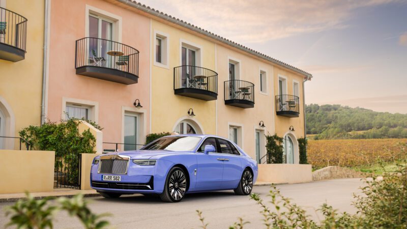 An image of a purple Rolls-Royce Ghost Series II parked outdoors.