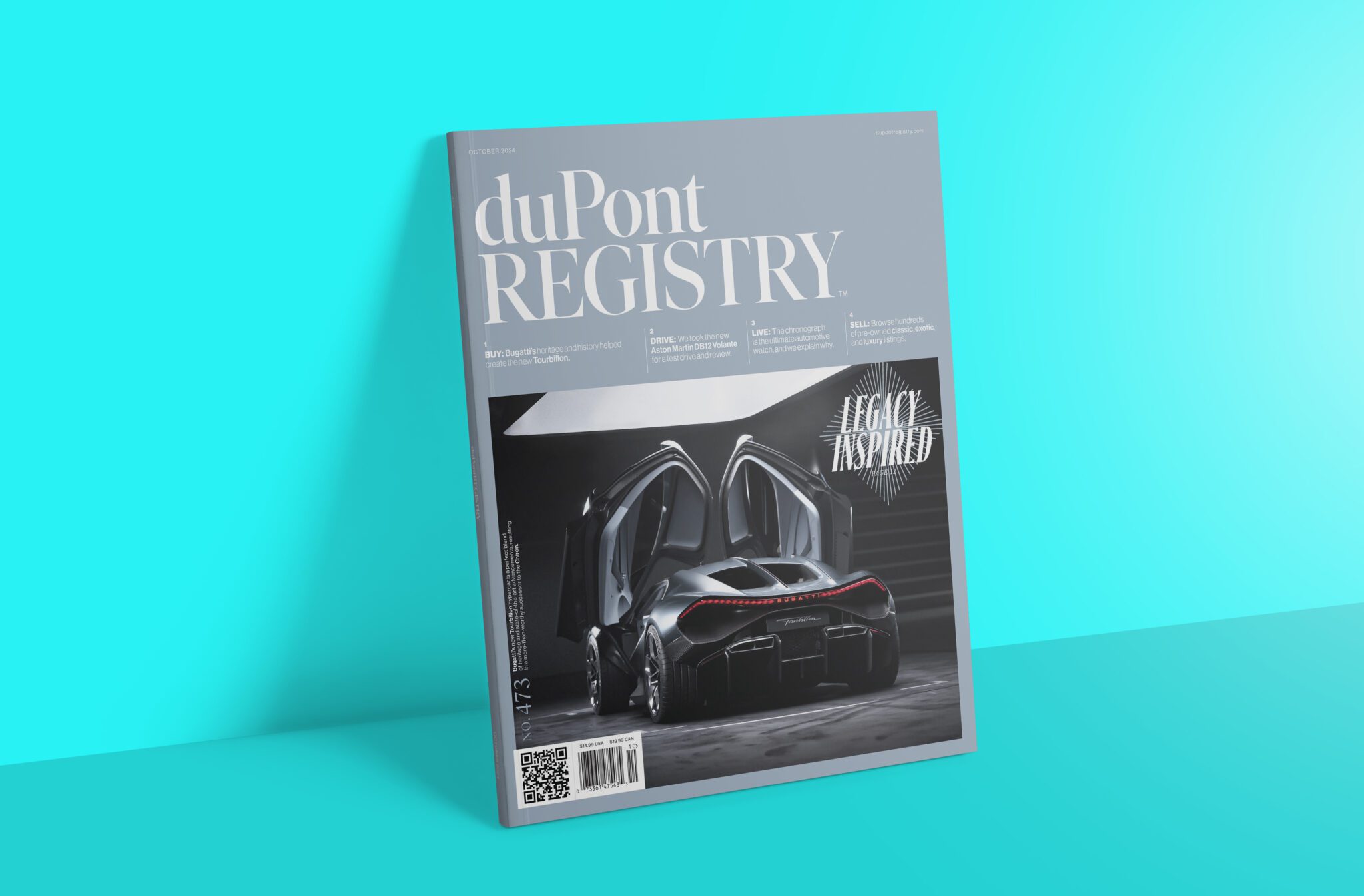 A magazine titled "duPont Registry" rests on a blue background, featuring a luxury car with open doors on the cover, alongside a sleek automotive watch.