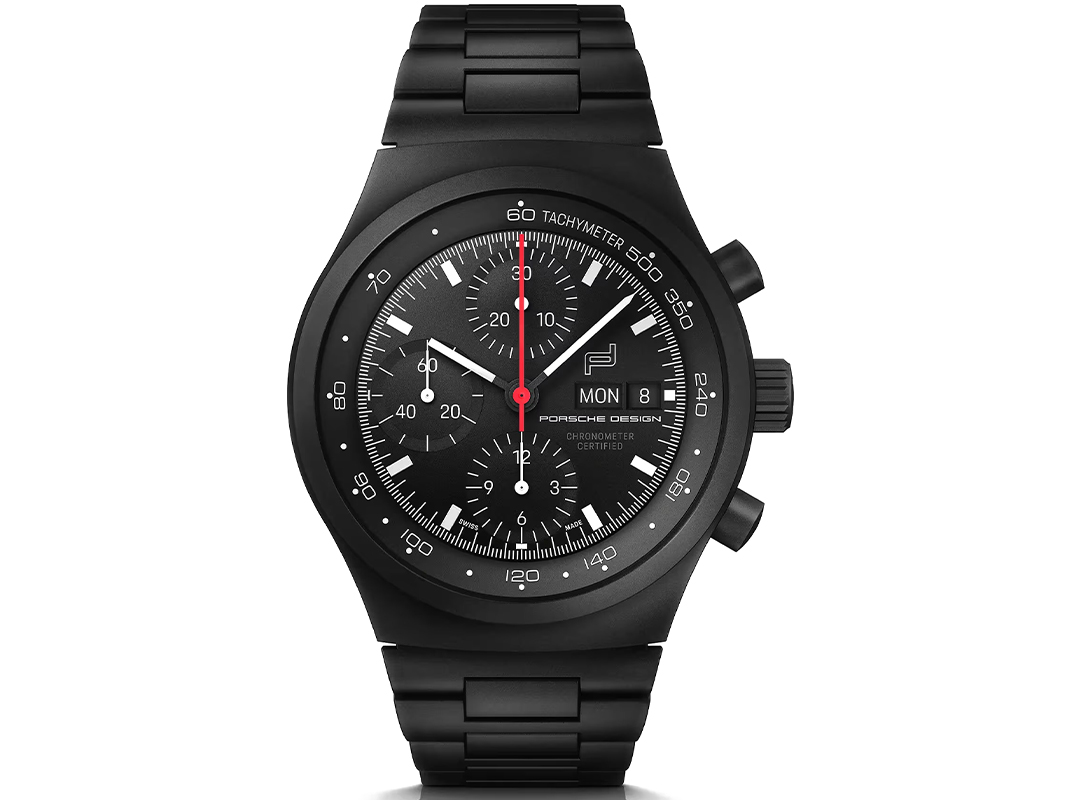A luxury Porsche Design chronograph watch in black, featuring three subdials, a tachymeter scale, and a day-date display on a metal link band—an icon among the best Porsche watches.