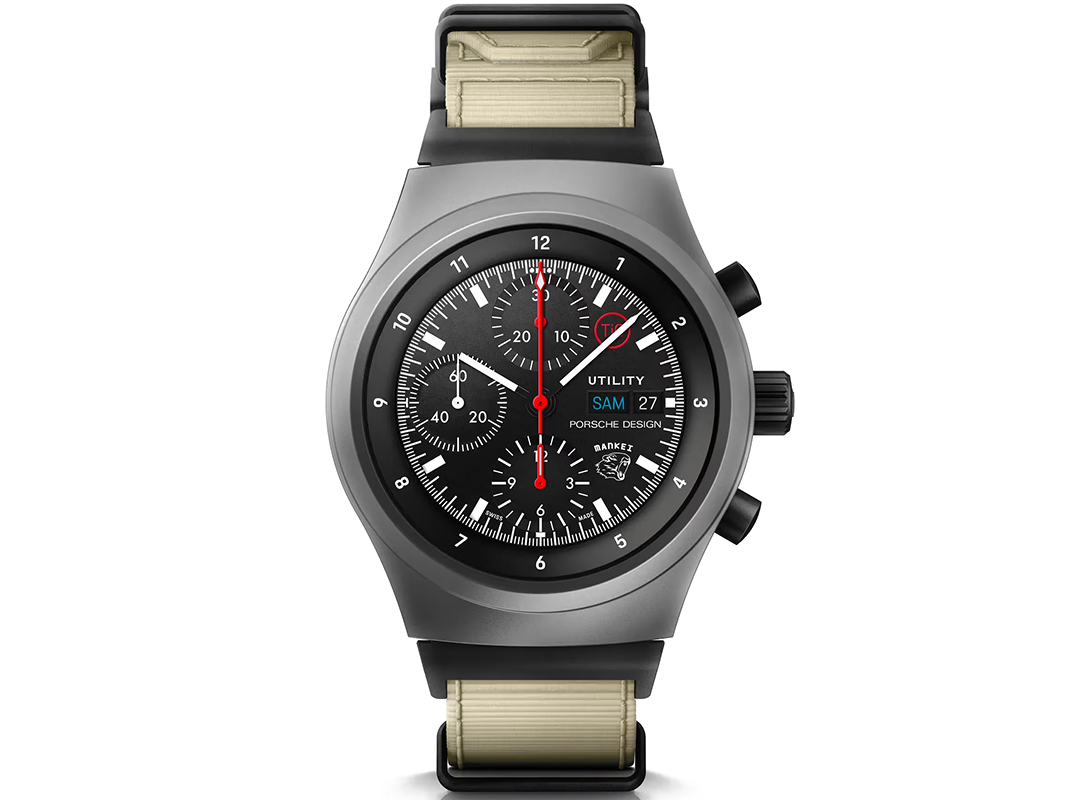 A black and silver Porsche Design chronograph wristwatch with a beige strap, black dial, three subdials, date window, and the text "UTILITY" and "Porsche Design" on the face—one of the best watches for style and function.