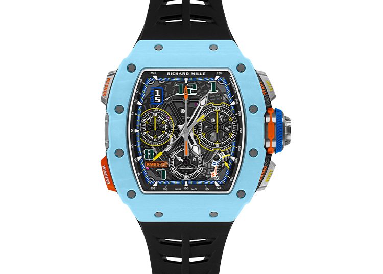 A luxury watch with a blue bezel and black straps, highlighted in the duPont REGISTRY guide, features a detailed chronograph with colorful numerals and multiple dials.