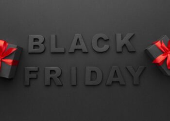 Black Friday 2024 text on a dark background with two black gift boxes wrapped in red ribbons, promising the biggest savings of the year as highlighted by duPont REGISTRY.