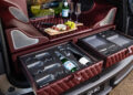 Experience the ultimate tailgating luxury with our exclusive setup. The Infiniti AUTOGRAPH Lounge transforms your car trunk into a lavish retreat, featuring fine wine, delicate charcuterie board, San Pellegrino, and sleek leather-lined storage for impeccable organization.