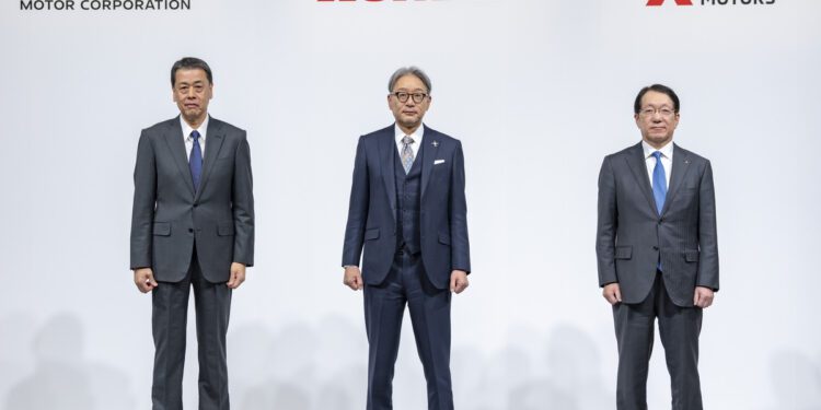 Three executives in suits stand confidently in front of the logos of renowned automakers, Nissan, Honda, and Mitsubishi Motors, displayed against a pristine white background.