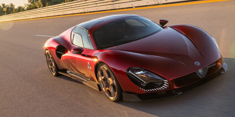 An Alfa Romeo 33 Stradale speeds along the track, as Valtteri Bottas expertly navigates each curve, with a barrier and trees in the background.