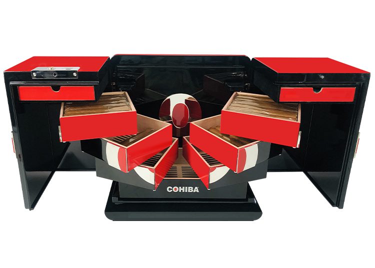 A black and red humidor with multiple open drawers and compartments labeled "Cohiba" makes a striking addition to the 2024 duPont REGISTRY Holiday Gift Guide. It's the perfect blend of elegance and utility, sure to delight any cigar aficionado.