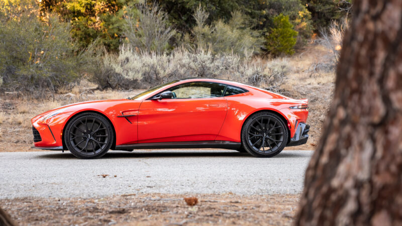 An image of an orange 2025 Aston Martin Vantage parked outdoors.