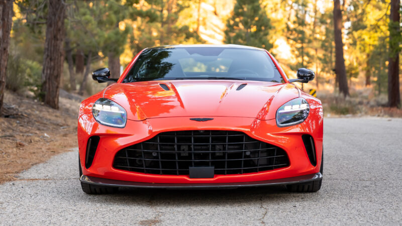 An image of an orange 2025 Aston Martin Vantage parked outdoors.