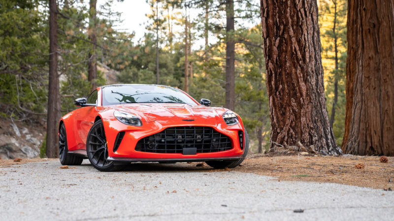 An image of an orange 2025 Aston Martin Vantage parked outdoors.