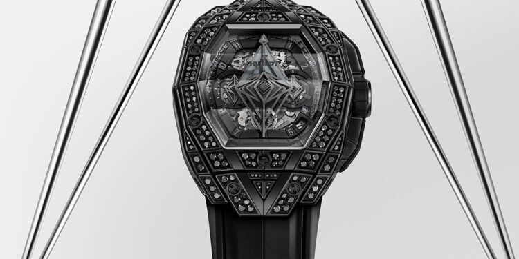 A geometric, intricately designed black watch from the Hublot Spirit of Big Bang collection features a multi-faceted bezel adorned with black diamond details, set against a modern metal triangular backdrop.